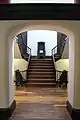 View of stairs through an archway