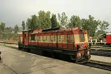 Tan-and-orange loco