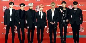From left: Ju-ne, Song, Jay, B.I, DK, Chanwoo, Bobby
