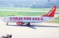 An EasyJet Switzerland Boeing 737-300 in the "phone number" paint-job.