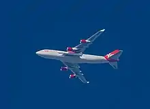 This mother ship (Cosmic Girl) can carry at least one LauncherOne launch vehicle. (The picture shows a LauncherOne under the left wing of the mother ship - between the fuselage and a jet engine.)