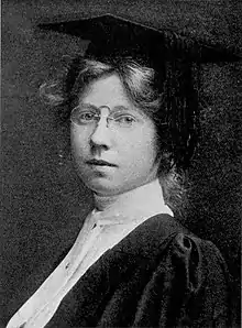 black and white headshot of a young woman with wavy hair