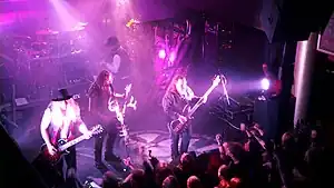 Korpiklaani playing music at a concert in 2011