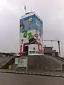 Lighthouse covered in graffiti