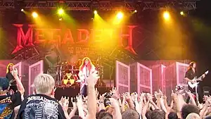 Megadeth playing music at a concert in 2010