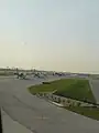 Planes lined up at the airport.