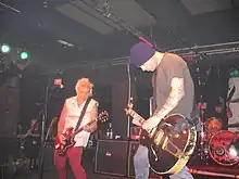 Rancid live in 2006. Pictured are Lars Frederiksen, Tim Armstrong and Brett Reed (back)