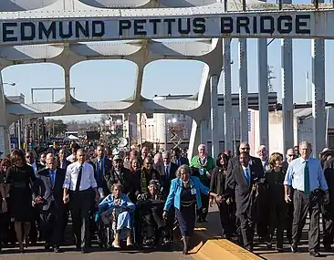The Obamas, ex-President Bush, and civil rights activists march across the Edmund Pettus Bridge