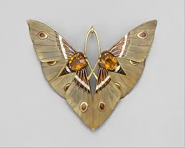 Moth pendant by Lucien Gaillard, of Gold, champlevé enamel, citrines, carved horn;(c. 1900–1902)(Metropolitan Museum)