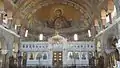 View of the marble Templon and the mural paintings depicting Panagia protecting the city of Patras