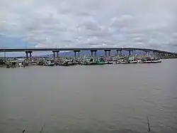 Taksin Maharat Bridge, part of Chaloem Burapha Chonlathit Road, Laem Sing and Tha Mai Districts