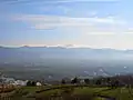 Panorama view of Yamanashi city and Kōfu Basin, from hill of Fuefuki River Fruit Park