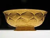 Tang era gilt-gold bowl with lotus and animal motifs