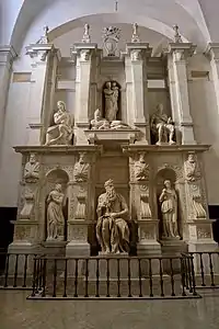 The tomb of Julius II, with Michelangelo's statues of Rachel and Leah on the left and the right of his Moses.