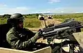 A member of the 5th Special Forces Regiment conducts security inside HMMWV