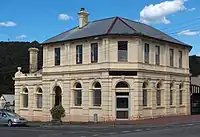 Former bank at 112 Main Street Zeehan. It was constructed by the Commercial Bank of Tasmania and opened in 1899. It was merged into the English, Scottish and Australian Bank in 1921 and the ANZ Bank in 1970, but the branch was closed by ANZ in late 2016.