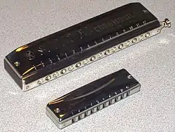 Chromatic 16-hole (over) and diatonic 10-hole (under) harmonica