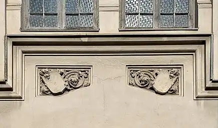 Gothic Revival shield-like cartouches on the Hermann I.Rieber carriage factory (Strada Romulus no. 17), Bucharest, by Siegfrid Kofczinsky, 1903