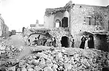 This is the Russian Monastery of Ascension on the Mount of Olives in which three people were killed. On the iron gate on the left, we can read : РУССКАЯ ДУХОВНАЯ МИССИЯ (Russian Ecclesiastical Mission)