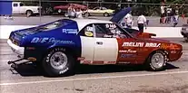 Shows a 1970 AMC Javelin dragstrip car at the starting lane