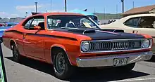 1971 Duster Twister in Tor-Red EV2 Orange. Picture displays sharktooth grill, Twister hoodscoops and hood strobe stripe.