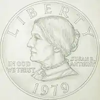 A drawing of one side of a coin, depicting the profile of a woman