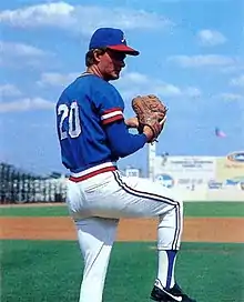 A baseball player in blue and white