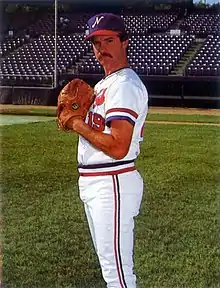 A baseball player in white