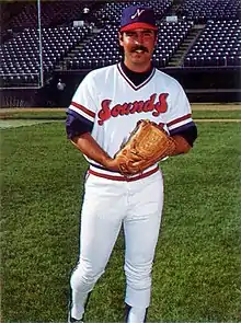 A baseball player in white