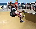 A skateboarder in mid flight performing a trick in Australia (2012)