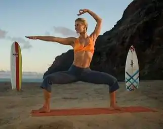 Shiva Rea demonstrating Utkata Konasana with a hand mudra