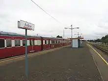 H type carriage in the V/line red livery at Ardeer.