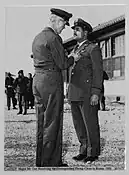 USAF photo of Major McGee receiving the Distinguished Flying Cross in Korea in 1951