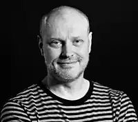 A black and white photo of Jonathan Barnbrook