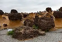 Light and dark brown rock formations in hoodoo shape