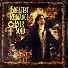 Prince stands with his arms out while wearing a brown robe in front of a golden portrait displaying the title of the song