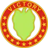 A hollow red circle with stars and the word "Victory", inside a green leaf