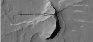 Possible fault along a butte, as seen by HiRISE under HiWish program.  These may be part of linear ridge networks that are produced with impact craters.