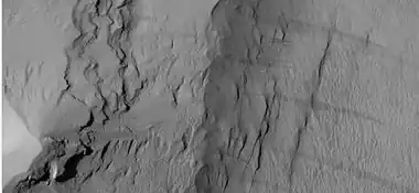 Close-up of some layers under cap rock of a pedestal crater, as seen by HiRISE under HiWish program