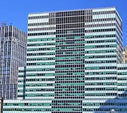 Blue-green and black facade of the 2 Broadway skyscraper