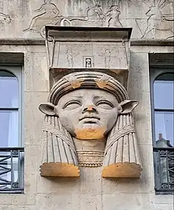 Egyptian Revival mascaron with the face of goddess Hathor on the facade of the Foire du Caire building (Place du Caire no. 2), Paris, by Philippe-Laurent Prétrel, 1798