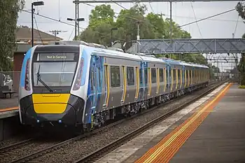 A modern train passing through a station