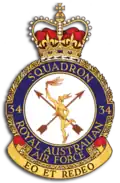 Crest of 34 Squadron, Royal Australian Air Force, featuring winged messenger in gold, two crossed arrows, and the motto "Eo et redeo"