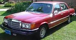 Older red four-door sedan