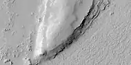 Close view of layers from previous image, as seen by HiRISE under HiWish program.  Some dark slope streaks are visible.