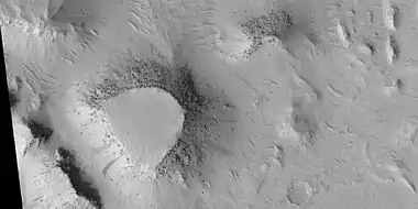 Mesas, as seen by HiRISE under HiWish program.  Top layer; the cap rock is breaking up into boulders.