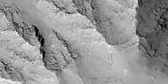 Close view of layers in Louros Valles, as seen by HiRISE under HiWish program.  Note this is an enlargement of a previous image.