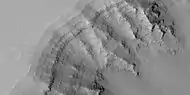 Close view of layers in Louros Valles, as seen by HiRISE under HiWish program  Note this is an enlargement of a previous image.