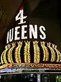 4 Queens facade at night