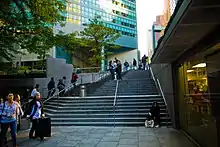 A 2007 image of stairs leading from the building's sunken plaza to street level